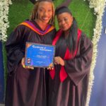 Shuga holds her graduation certificate on the set of her video for 'My Journey.'