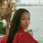 Shenseea looks back during music video for "Die For You."
