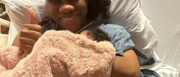 CVM morning host, Khadine "Miss Kitty" Hylton, holds her daughter after giving birth.