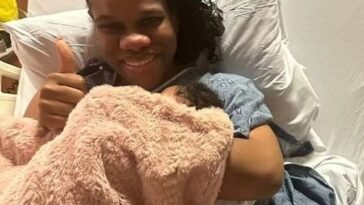 CVM morning host, Khadine "Miss Kitty" Hylton, holds her daughter after giving birth.