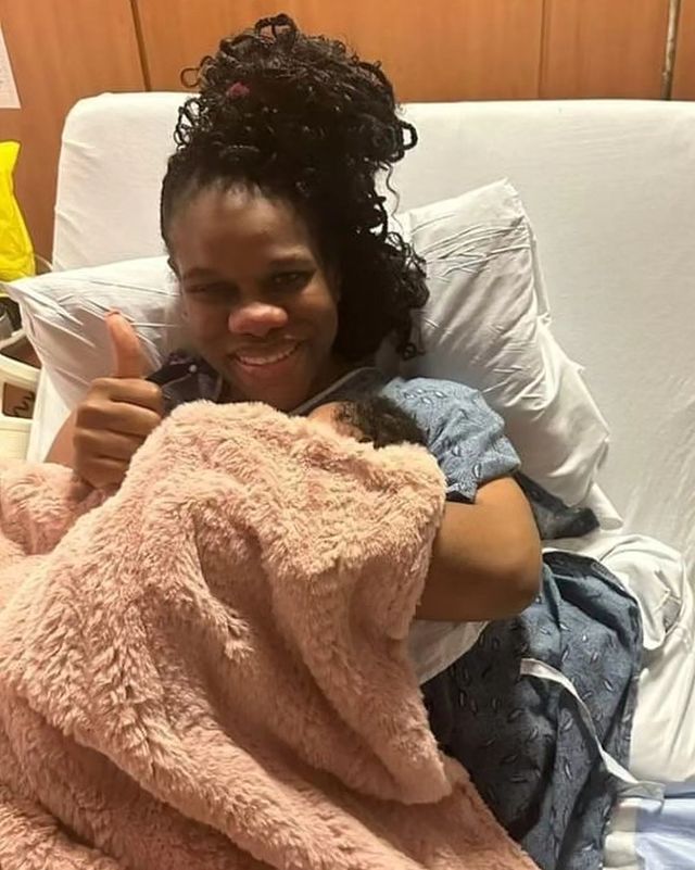 CVM morning host, Khadine "Miss Kitty" Hylton, holds her daughter after giving birth.