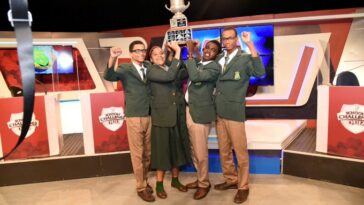 St. Jago's School's Challenge Quiz team raises the trophy after winning the 2024 final vs. Calabar High School