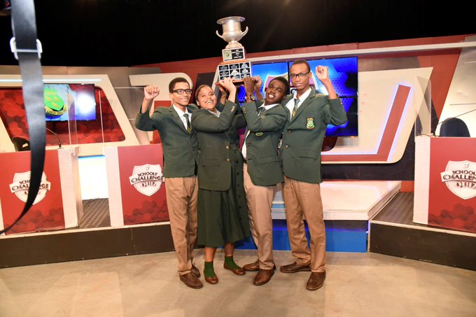 St. Jago's School's Challenge Quiz team raises the trophy after winning the 2024 final vs. Calabar High School