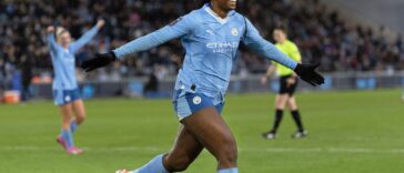 Khadija Shaw celebrates after scoring a goal.