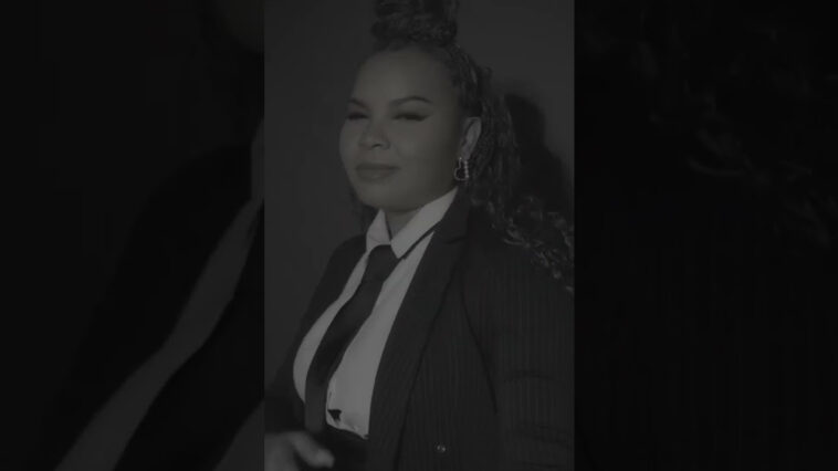 Ce'Cile poses during her music video for "Boss."