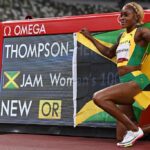 Elaine Thompson-Herah poses after breaking the Olympic women's 100m record at Tokyo 2020.