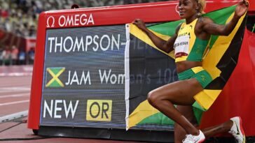 Elaine Thompson-Herah poses after breaking the Olympic women's 100m record at Tokyo 2020.