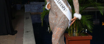 Dr. Sandra Swaby poses with her sash as she enters the Miss Universe Jamaica finals.