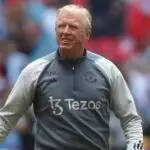 Steve McClaren walks on the field during a Manchester United game.