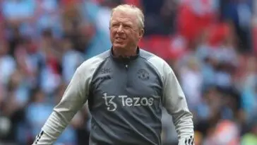 Steve McClaren walks on the field during a Manchester United game.