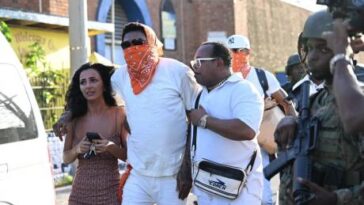 Vybz Kartel walks out of prison with his fiancee, Sidem Ozturk.