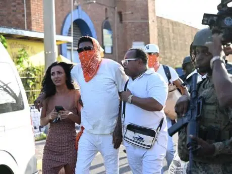 Vybz Kartel walks out of prison with his fiancee, Sidem Ozturk.