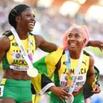 Shericka Jackson and Shelly-Ann Fraser-Pryce celebrate at the 2022 IAAF World Championships