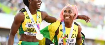 Shericka Jackson and Shelly-Ann Fraser-Pryce celebrate at the 2022 IAAF World Championships