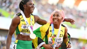 Shericka Jackson and Shelly-Ann Fraser-Pryce celebrate at the 2022 IAAF World Championships