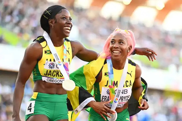 Shericka Jackson and Shelly-Ann Fraser-Pryce celebrate at the 2022 IAAF World Championships