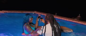 Spice has wine with her male lead in the music video for 'Ex Boyfriend.'