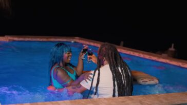 Spice has wine with her male lead in the music video for 'Ex Boyfriend.'