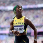Shelly-Ann Fraser-Pryce looks at the crowd after her women's 100m heat at the Paris 2024 Olympics.