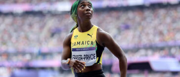 Shelly-Ann Fraser-Pryce looks at the crowd after her women's 100m heat at the Paris 2024 Olympics.