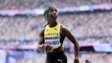 Shelly-Ann Fraser-Pryce looks at the crowd after her women's 100m heat at the Paris 2024 Olympics.