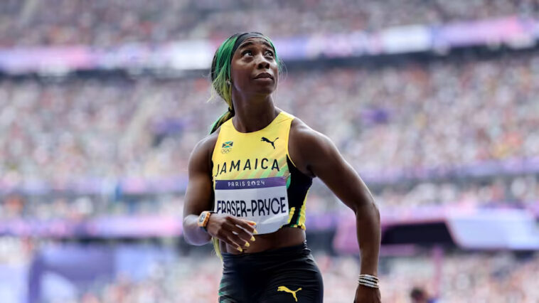 Shelly-Ann Fraser-Pryce looks at the crowd after her women's 100m heat at the Paris 2024 Olympics.