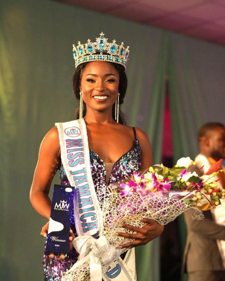 Tahje Bennett holds her award and flowers after being crowned the new Miss Jamaica World.