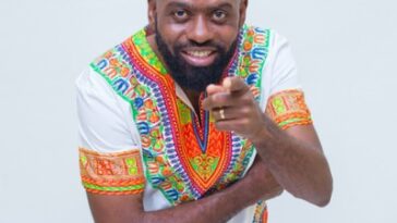 Lt. Stichie points at the camera during a photoshoot.