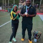 Shelly-Ann Fraser-Pryce with her former coach, Elite Performance Track Club's Reynaldo Walcott.