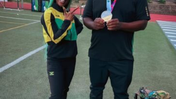 Shelly-Ann Fraser-Pryce with her former coach, Elite Performance Track Club's Reynaldo Walcott.