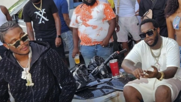 Masicka and Teejay on the set of the music video for 'Never Complain'