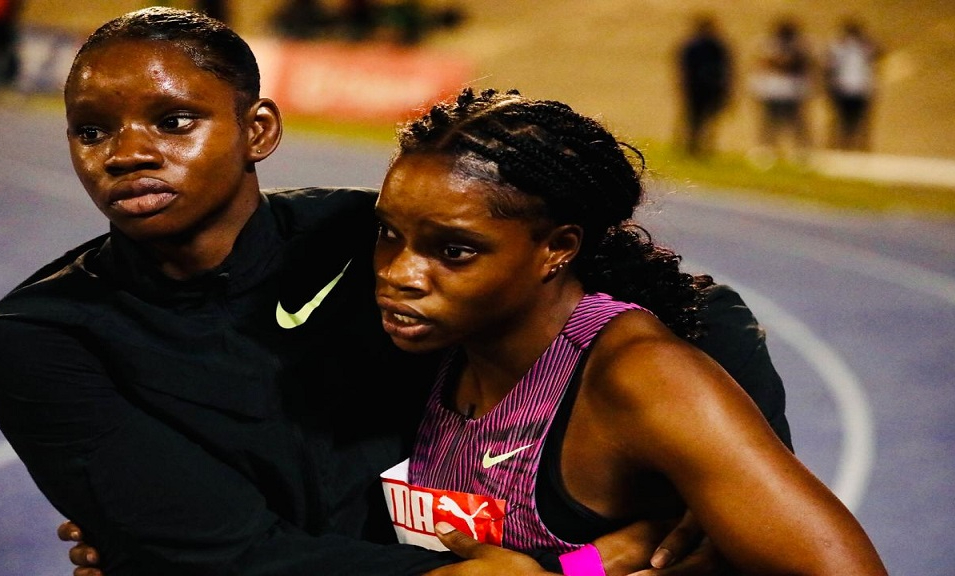 Tina Clayton (left) supports sister Tia Clayton (right) at the 2024 Jamaica Olympic Trials.