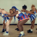 Spice vibes with her dancers during the music video for 'Hell No.'