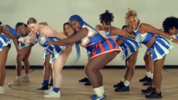 Spice vibes with her dancers during the music video for 'Hell No.'