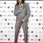 Vybz Kartel poses on the MOBO Awards red carpet.