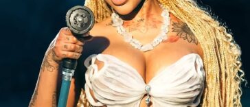 Jada Kingdom sprays a hose during the 'Only You' music video.