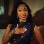 Shenseea in a sequence from her Puni Police music video.