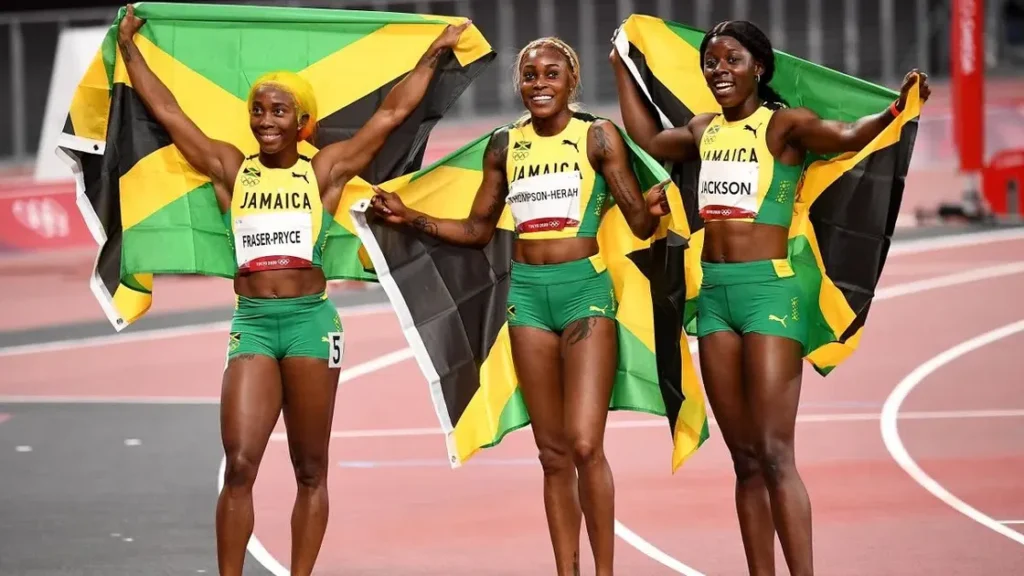 Shelly-Ann Fraser-Pryce, Elaine Thompson Herah and Shericka Jackson celebrate sweeping the podium at the 2022 IAAF World Championships