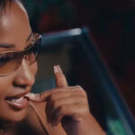 Shenseea bites her lip during her music video for 'Self Love'