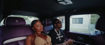 Masicka rolls around in the streets during the music video for 'Rich Sex.'