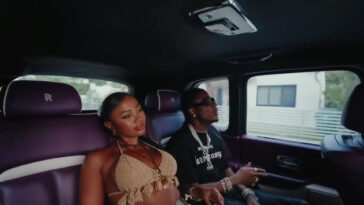 Masicka rolls around in the streets during the music video for 'Rich Sex.'