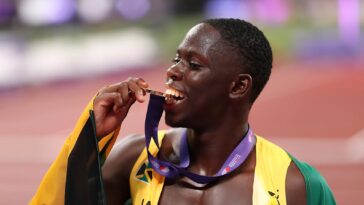 Team Jamaica star Oblique Seville celebrates with his gold medal at the 2025 IAAF World Championships in Tokyo.