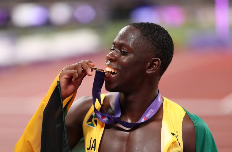 Team Jamaica star Oblique Seville celebrates with his gold medal at the 2025 IAAF World Championships in Tokyo.
