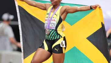 Tina Clayton celebrates after winning the silver medal in the women's 100m at the 2025 IAAF World Championships.