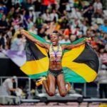 Shericka Jackson celebrates following the women's 200m final at the 2025 IAAF World Championships in Tokyo.