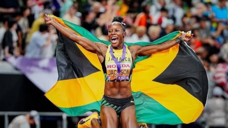 Shericka Jackson celebrates following the women's 200m final at the 2025 IAAF World Championships in Tokyo.