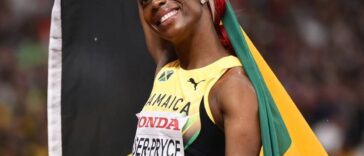 Shelly-Ann Fraser-Pryce celebrates after her final race at Tokyo 2025