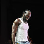Mavado performs and looks on the crowd.
