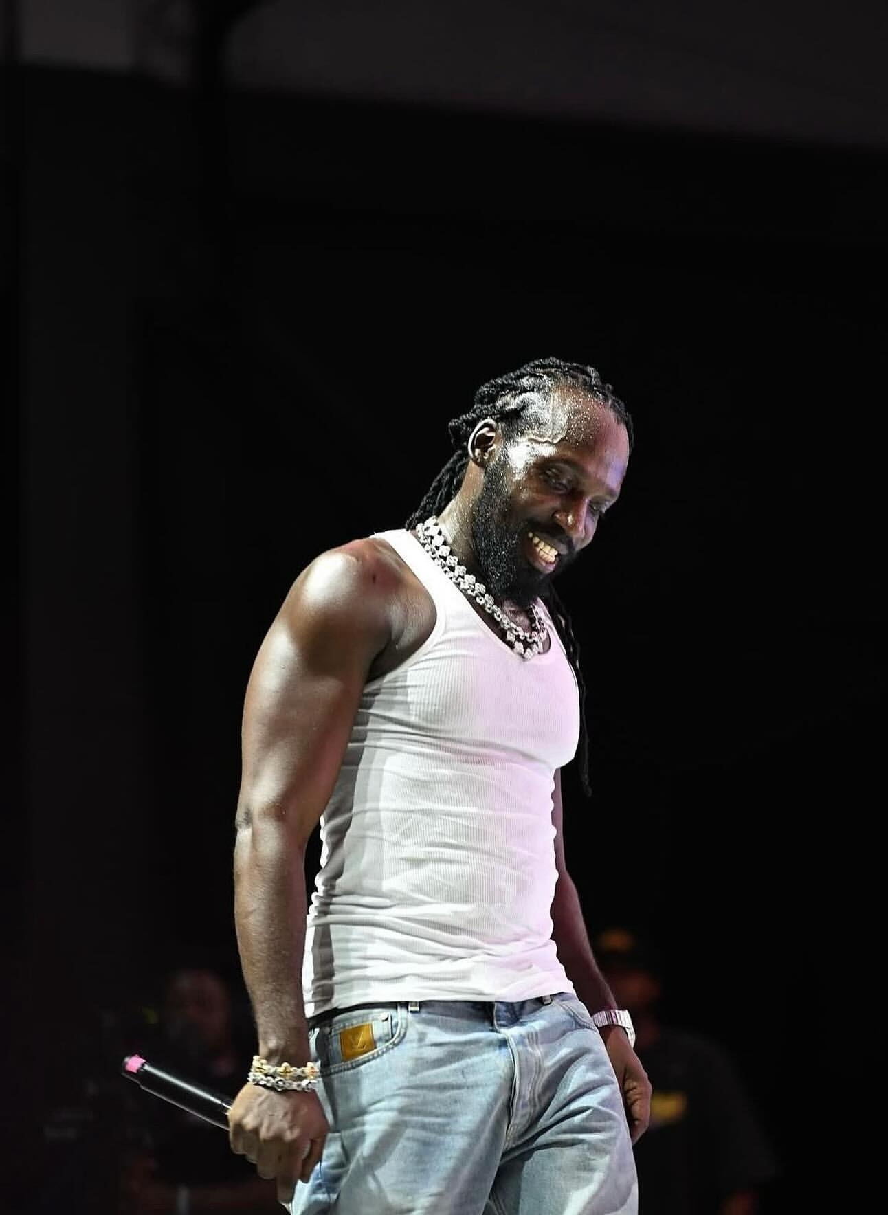 Mavado performs and looks on the crowd.