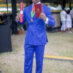 Yohan Blake accepts his national award, the Order of Distinction in the rank of Commander, on Oct. 20, 2025.